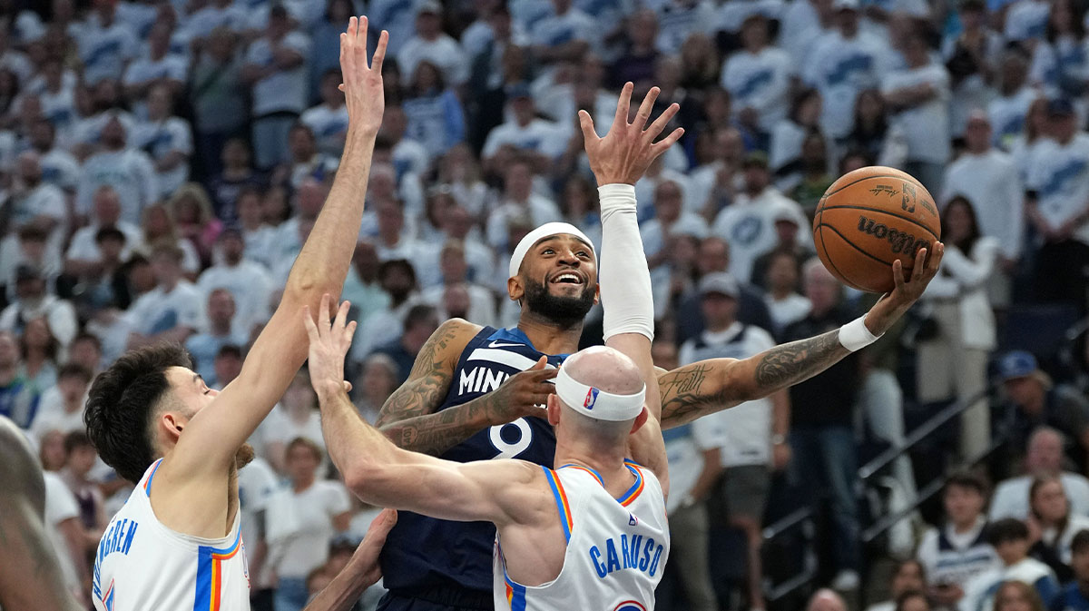 Minnesota Timberwolves guard Nickeil Alexander-Walker (9) shoots the ball over Oklahoma City Thunder guard Alex Caruso (9) in the second half during game four of the western conference finals for the 2025 NBA Playoffs at Target Center.