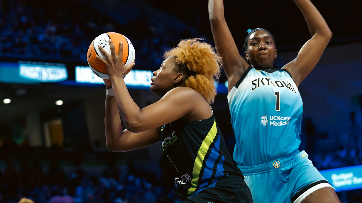 Dallas Wings forward NaLyssa Smith (1) scores a basket against Chicago Sky center Elizabeth Williams (1) during the second half at College Park Center.