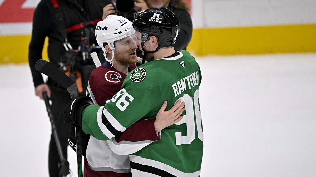 Colorado Avalanche center Nathan MacKinnon (29) hugs Dallas Stars right wing Mikko Rantanen (96) after the Stars defeats the Avalanche in game seven of the first round of the 2025 Stanley Cup Playoffs at American Airlines Center.