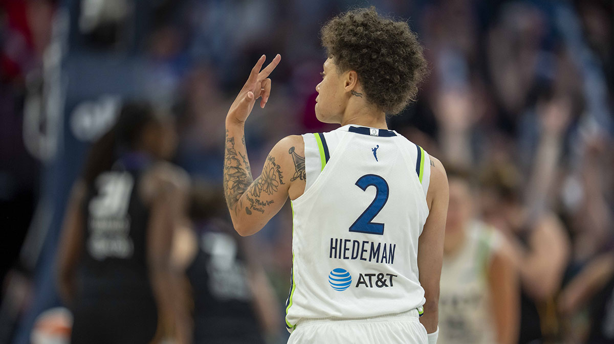 Minnesota Lynx guard Natisha Hiedeman (2) celebrates after making a three point shot against the Connecticut Sun in the second half at Target Center.