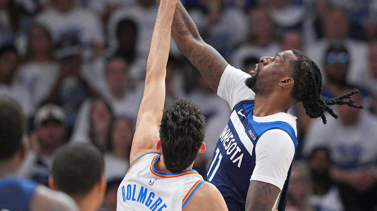Minnesota Timberwolves center Naz Reid (11) shoots the ball over Oklahoma City Thunder forward Chet Holmgren (7) during the first half in game three of the western conference finals for the 2025 NBA Playoffs at Target Center