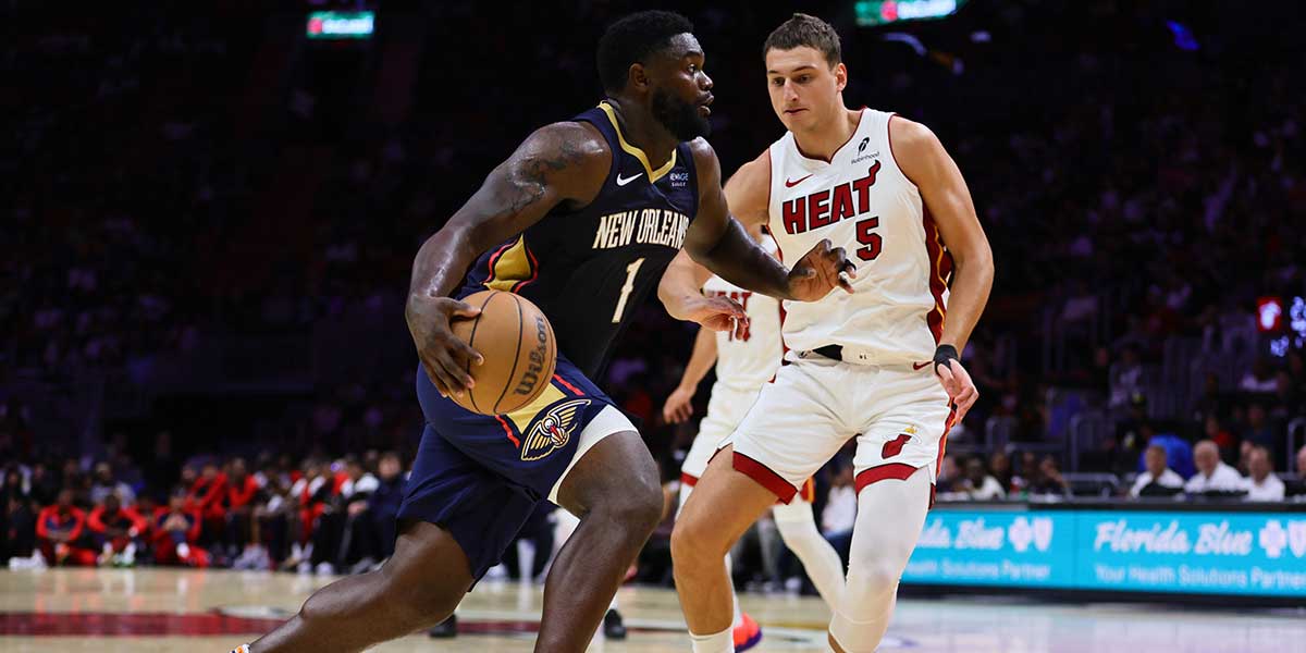 New Orleans Pelicans forward Zion Williamson (1) drives to the basket against Miami Heat forward Nikola Jovic (5) during the second quarter at Kaseya Center.