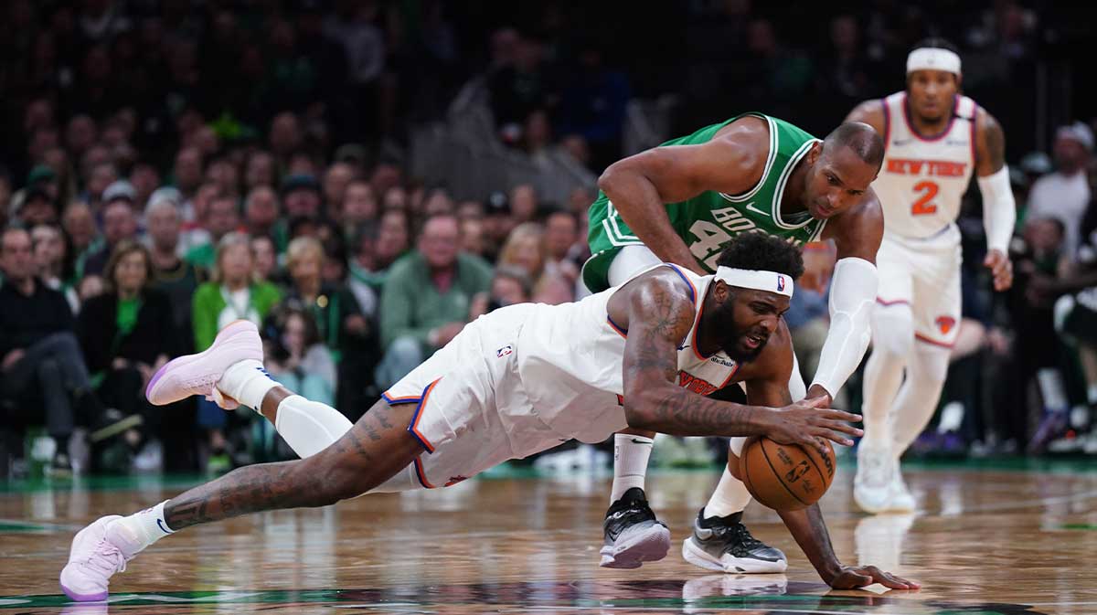 New York Knicks center Mitchell Robinson (23) works for the ball against Boston Celtics center Al Horford (42) in the second quarter during game two of the second round for the 2025 NBA Playoffs at TD Garden.