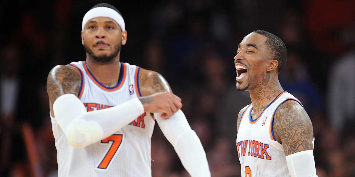 New York Knicks guard J.R. Smith (8) and forward Carmelo Anthony (7) look on against the Brooklyn Nets during the second half at Madison Square Garden. The New York Knicks won 110-81.
