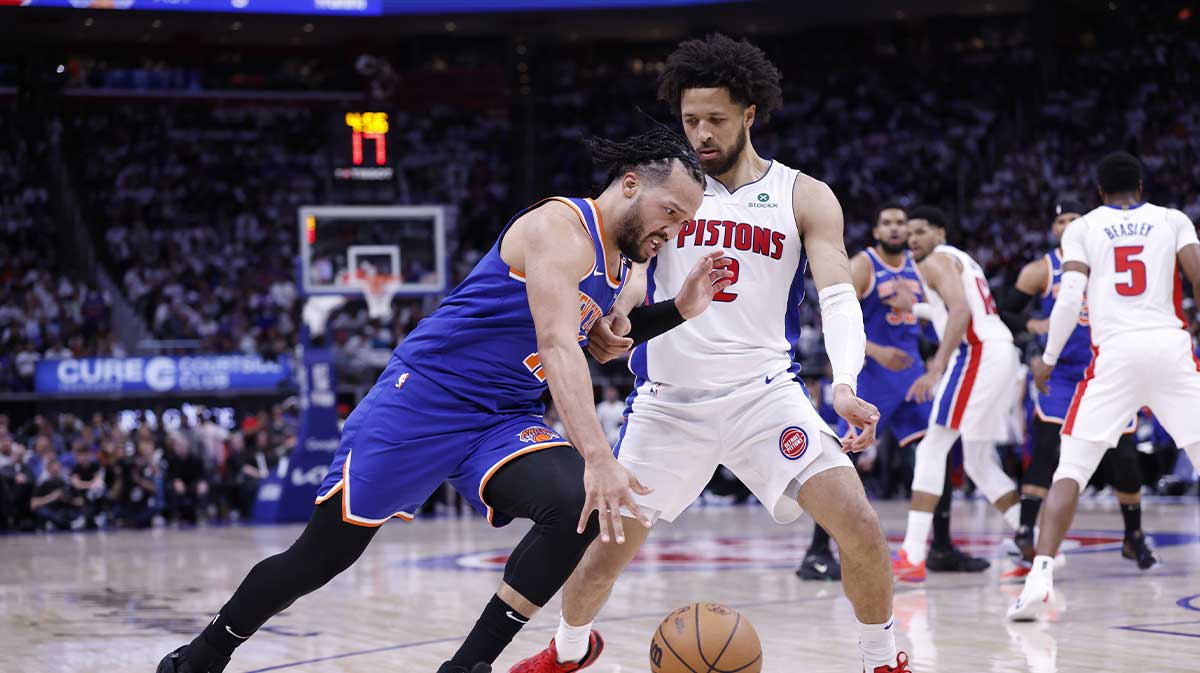 New York Knicks guard Jalen Brunson (11) dribbles on Detroit Pistons guard Cade Cunningham (2) in the first half during game six of first round for the 2024 NBA Playoffs at Little Caesars Arena.