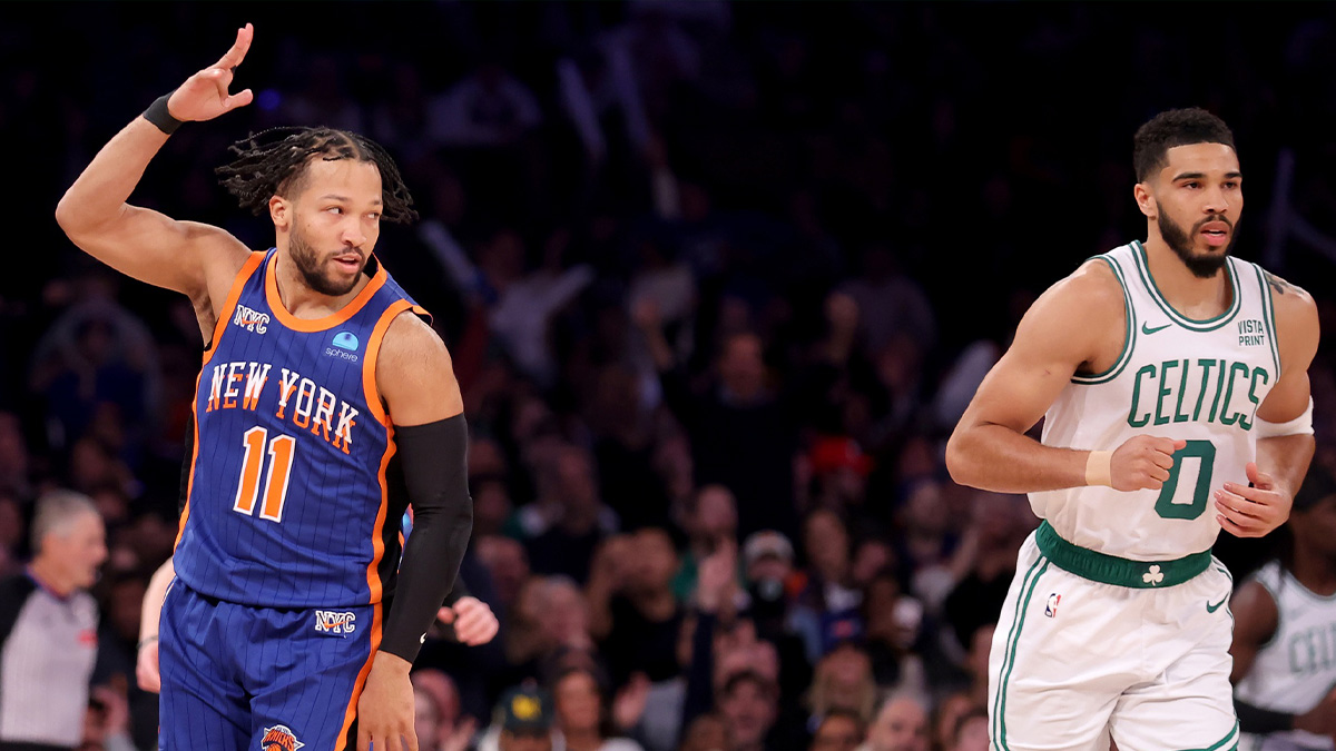 New York Knicks guard Jalen Brunson (11) celebrates his three point shot against Boston Celtics forward Jayson Tatum (0) during the first quarter at Madison Square Garden.