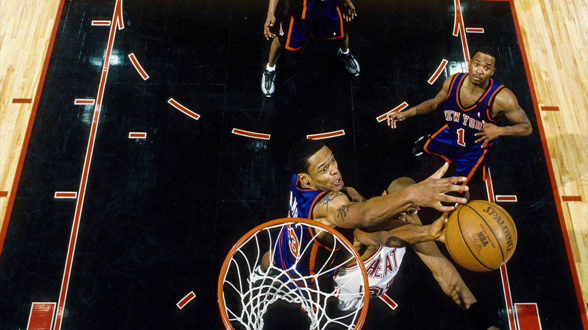 New York Knicks center Marcus Camby (23) blocks Miami Heat center Alonzo Mourning (33) during the the first round of the 1999 NBA Playoffs at the Miami Arena.