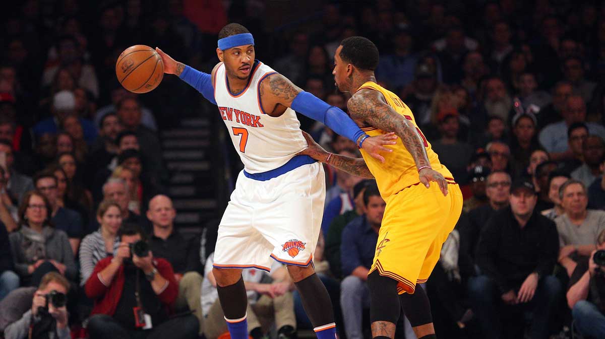 New York Knicks small forward Carmelo Anthony (7) controls the ball against Cleveland Cavaliers shooting guard J.R. Smith (5) during the first quarter at Madison Square Garden. Brad Penner-Imagn Images
