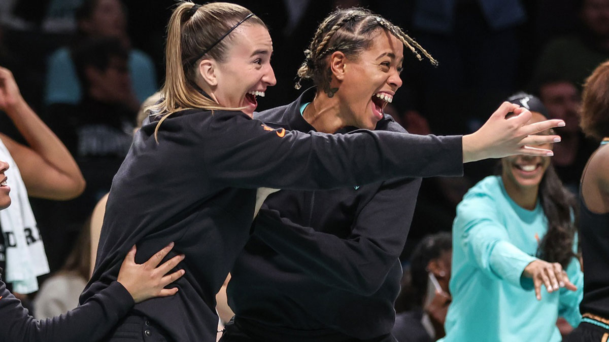 New York Liberty guards Sabrina Ionescu and Natasha Cloud celebrate from the bench in the fourth quarter against the Connecticut Sun at Barclays Center.