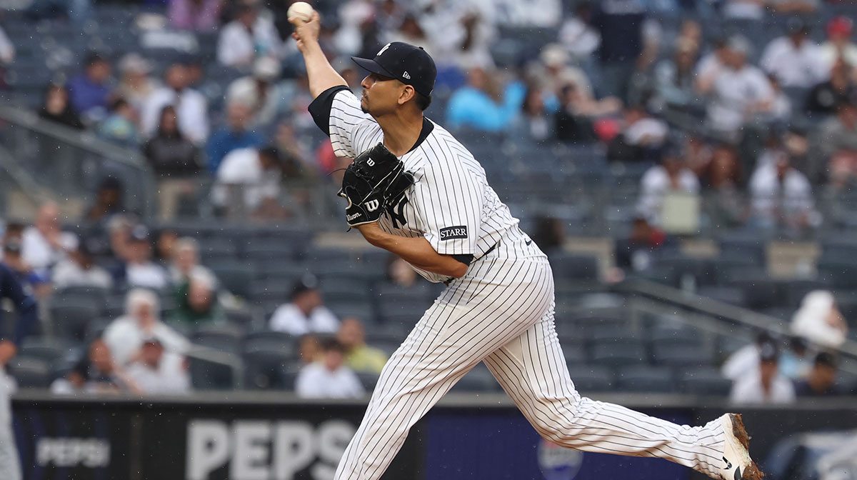 New York Yankees starting pitcher Carlos Carrasco (59) delivers a pitch during the ninth inning against the Tampa Bay Rays during the ninth inning at Yankee Stadium.