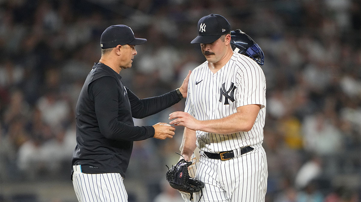 New York Yankees manager Aaron Boone (17) takes out pitcher Carolos Rodon (55) during the fourth inning against the Detroit Tigers at Yankee Stadium.
