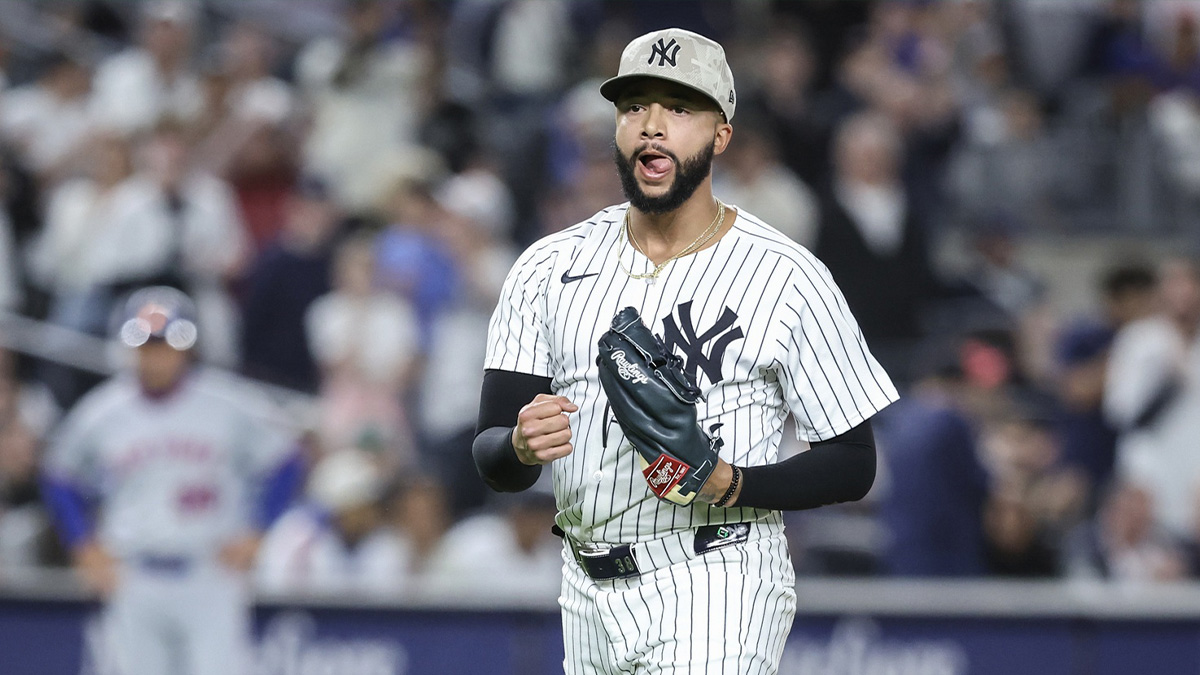 New York Yankees relief pitcher Devin Williams (38) reacts after retiring the side in the eighth inning against the New York Mets at Yankee Stadium.