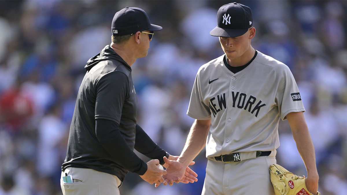 New York Yankees manager Aaron Boone relieves pitcher Will Warren (98) in the second inning against the Los Angeles Dodgers at Dodger Stadium.