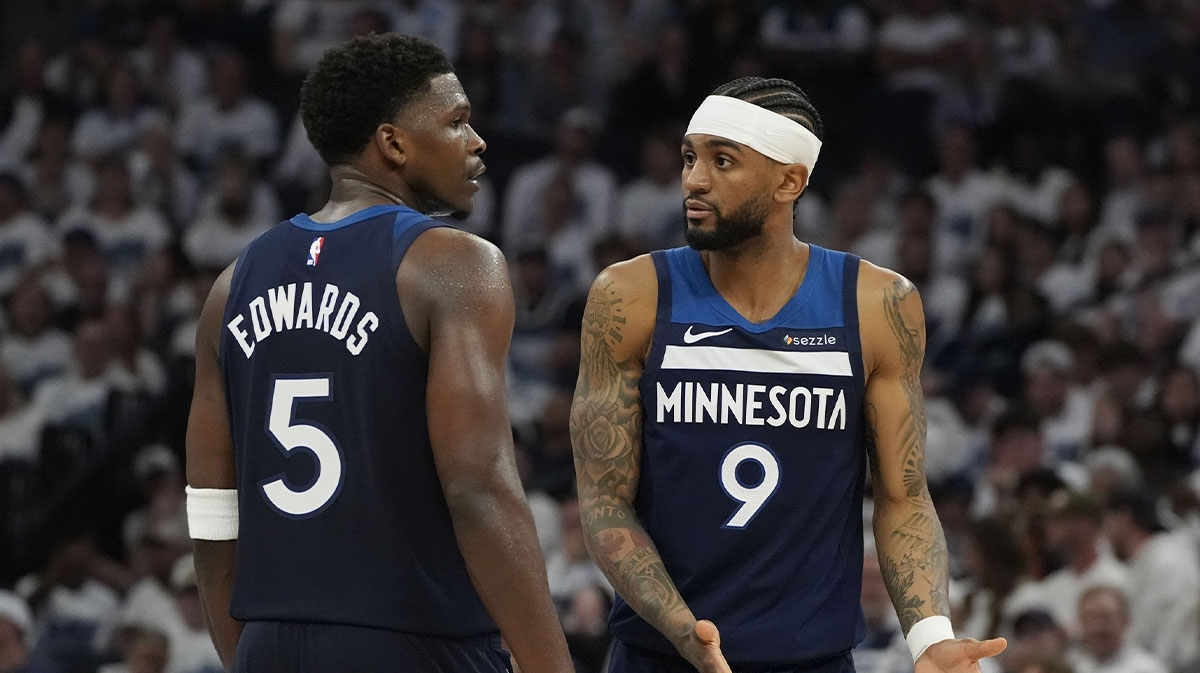 Minnesota Timberwolves guard Nickeil Alexander-Walker (9) and guard Anthony Edwards (5) talk against the Oklahoma City Thunder in the second half during game four of the western conference finals for the 2025 NBA Playoffs at Target Center.