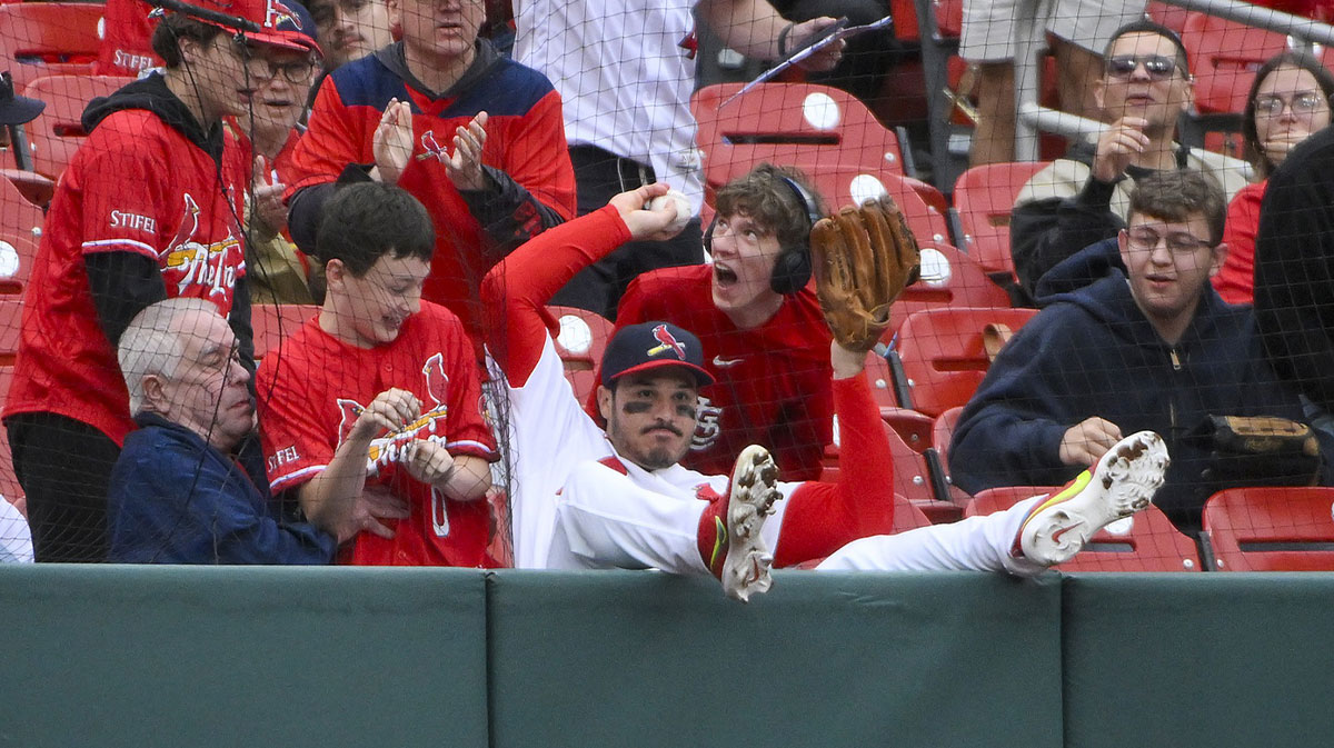 St. Louis Cardinals third baseman Nolan Arenado (28) falls in to the crowd after catching a foul ball hit by Arizona Diamondbacks second baseman Ketel Marte (not pictured) during the ninth inning at Busch Stadium.