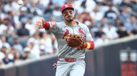 St. Louis Cardinals third baseman Nolan Arenado (28) throws a runner out at first base in the first inning against the New York Yankees at Yankee Stadium.