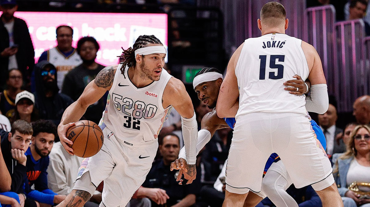 ; Denver Nuggets forward Aaron Gordon (32) controls the ball as center Nikola Jokic (15) screens against Oklahoma City Thunder guard Shai Gilgeous-Alexander (2) in the second quarter during game six of the second round for the 2025 NBA Playoffs at Ball Arena.