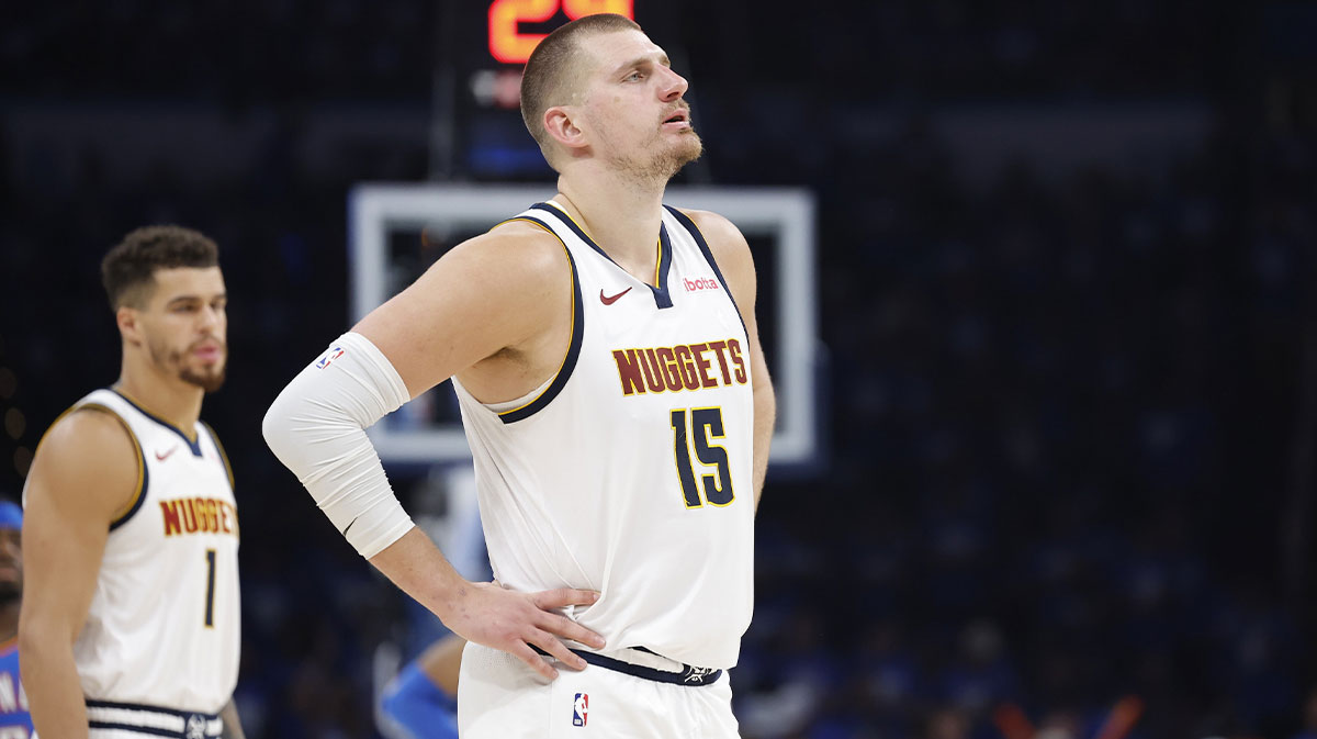 Nuggets center Nikola Jokic (15) watches Oklahoma City Thunder guard Shai Gilgeous-Alexander shoot free throws in the second half of game seven of the second round for the 2025 NBA Playoffs at Paycom Center