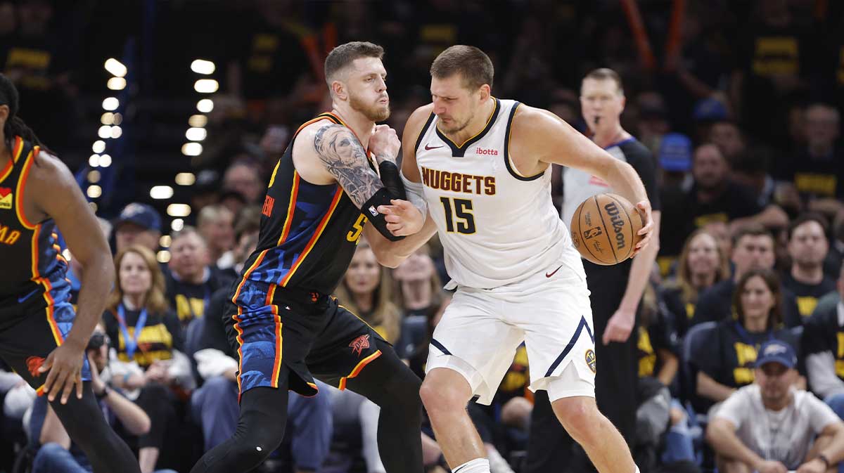Nuggets center Nikola Jokic (15) drives against Oklahoma City Thunder center Isaiah Hartenstein (55) in the second half during game two of the second round for the 2025 NBA Playoffs at Paycom Center next to Thunder head coach Mark Daigneault