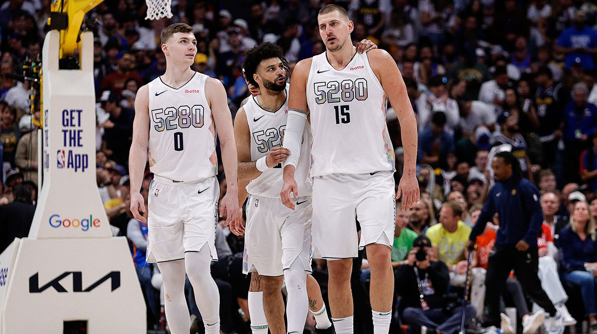 Nuggets guard Jamal Murray (27) and center Nikola Jokic (15) and guard Christian Braun (0) in the fourth quarter against the Oklahoma City Thunder during game six of the second round for the 2025 NBA Playoffs at Ball Arena with Nuggets' Aaron Gordon in the background