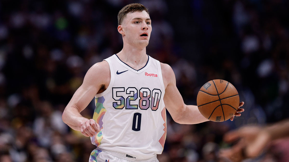 Denver Nuggets guard Christian Braun (0) dribbles the ball up court in the third quarter against the Oklahoma City Thunder during game six of the second round for the 2025 NBA Playoffs at Ball Arena.