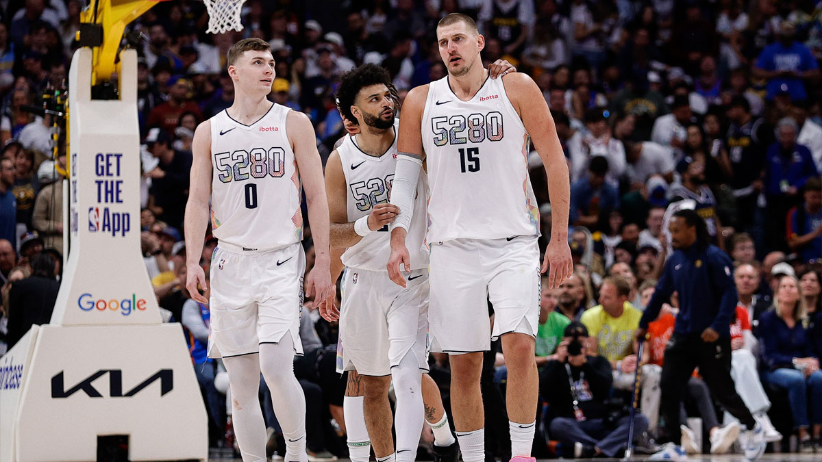 Denver Nuggets guard Jamal Murray (27) and center Nikola Jokic (15) and guard Christian Braun (0) in the fourth quarter against the Oklahoma City Thunder during game six of the second round for the 2025 NBA Playoffs at Ball Arena.