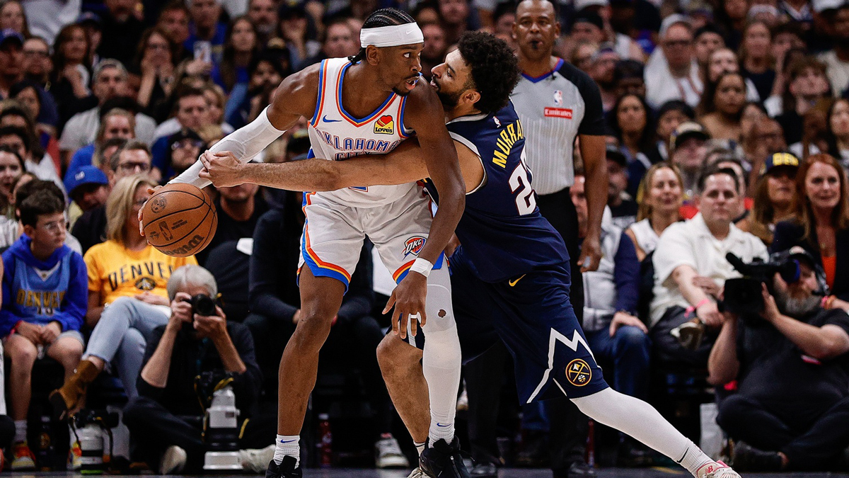 Oklahoma City Thunder guard Shai Gilgeous-Alexander (2) controls the ball under pressure from Denver Nuggets guard Jamal Murray (27) in the fourth quarter during game four of the second round of the 2025 NBA Playoffs at Ball Arena.