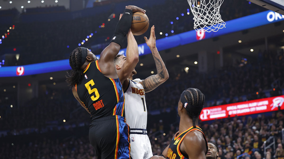 Oklahoma City Thunder guard Luguentz Dort (5) blocks a shot by Denver Nuggets forward Michael Porter Jr. (1) during the second quarter during game one of the second round for the 2025 NBA Playoffs at Paycom Center.