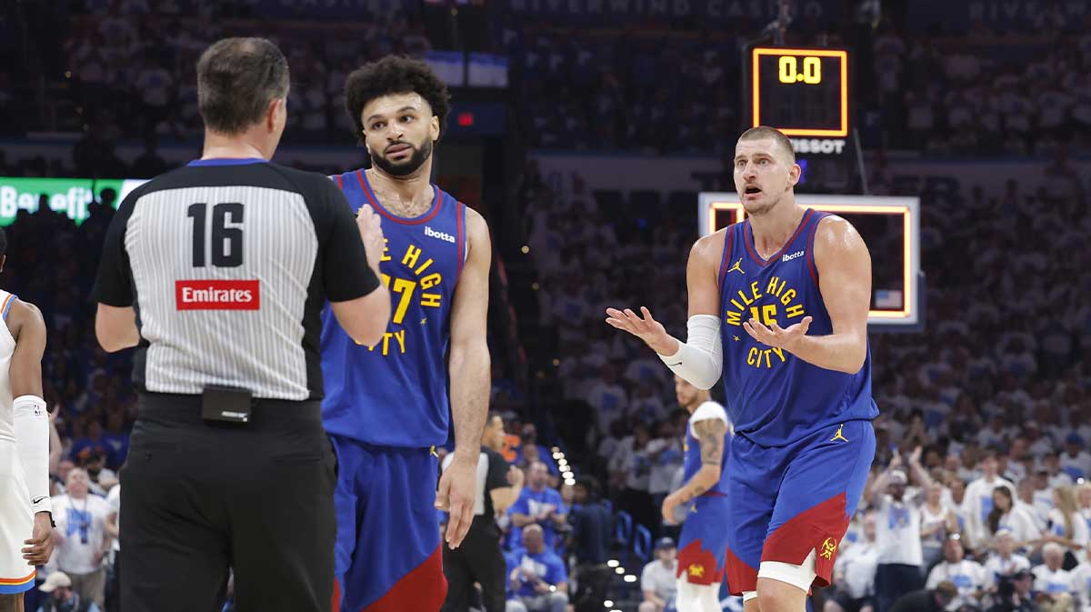 Nuggets guard Jamal Murray (27) and center Nikola Jokic (15) react