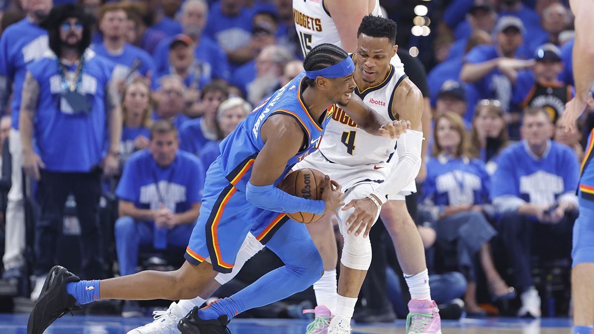 Nuggets guard Russell Westbrook fouls Thunder's Shai Gilgeous-Alexander