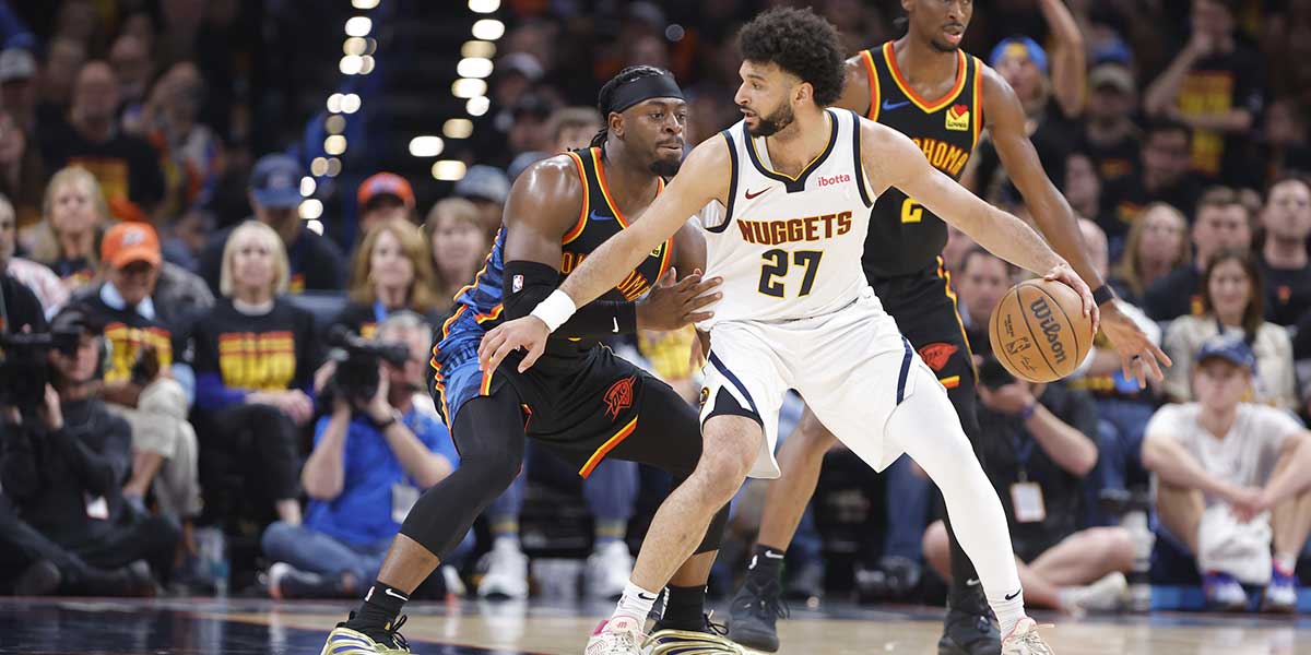 Oklahoma City Thunder guard Luguentz Dort (5) defends Denver Nuggets guard Jamal Murray (27) during the second half in game one of the second round for the 2025 NBA Playoffs at Paycom Center.