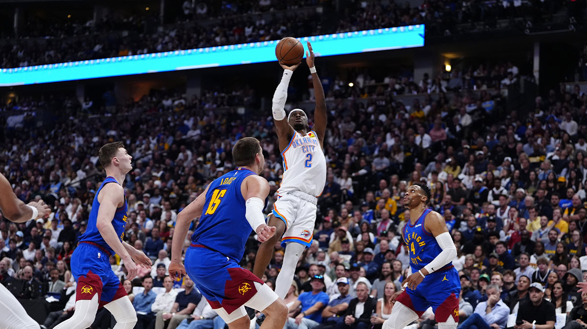 The Oklahoma Thunder goalkeeper City Shai Gilgeous-Alexander (2) defends the center of Denver Nuggets Nikola Jokic (15) in the second period in the third round match for the NBA 2025 qualifiers in Ball Arena.