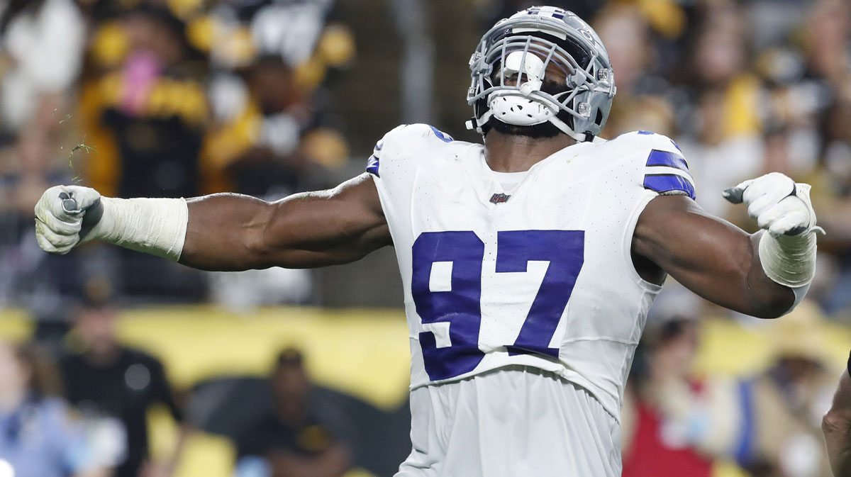 Dallas Cowboys defensive tackle Osa Odighizuwa (97) reacts to sacking Pittsburgh Steelers quarterback Justin Fields (not pictured) during the second quarter at Acrisure Stadium.