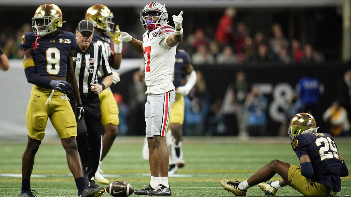 Ohio State Buckeyes wide receiver Carnell Tate (17) points for a first down after a catch against Notre Dame Fighting Irish in the second quarter during the College Football Playoff National Championship at Mercedes-Benz Stadium in Atlanta.