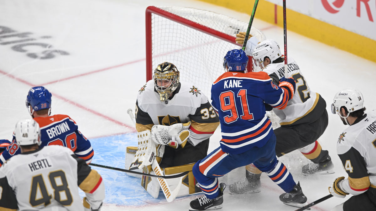 Vegas Golden Knights goalie Adin Hill (33) and defenseman Zach Whitecloud (2) battles Edmonton Oilers left winger Evander Kane (91) for the puck during the first period in game three of the second round of the 2025 Stanley Cup Playoffs at Rogers Place.