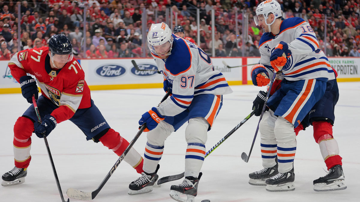 Edmonton Oilers center Connor McDavid (97) moves the puck as Florida Panthers defenseman Niko Mikkola (77) defends during the third period at Amerant Bank Arena.
