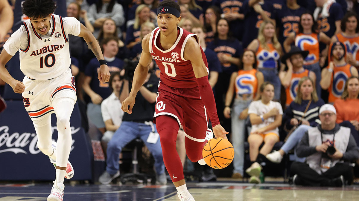 Oklahoma Sooners guard Jeremiah Fears (0) gets past Auburn Tigers guard Chad Baker-Mazara (10) during the first half at Neville Arena.