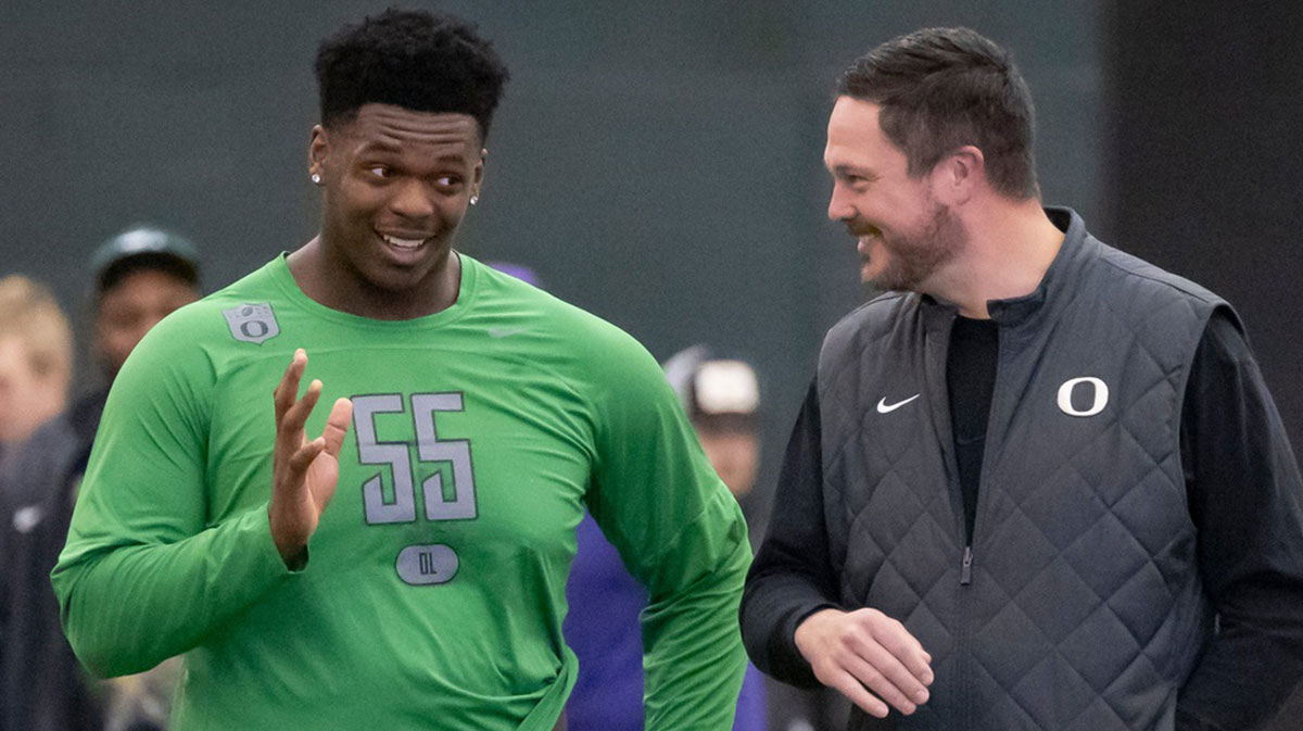 Oregon offensive lineman Marcus Harper II, left, talks to Oregon head coach Dan Lanning during the Oregon football’s Pro Day Tuesday, March 18, 2025, at the Moshofsky Center in Eugene, Ore.