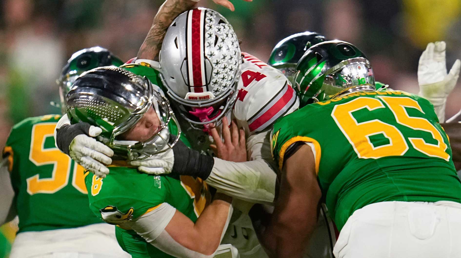 Ohio State defensive end JT Tuimoloau (44) hits Oregon quarterback Dillon Gabriel during the second half of the College Football Playoff quarterfinal at the Rose Bowl in Pasadena, Calif. on Jan. 1, 2025.