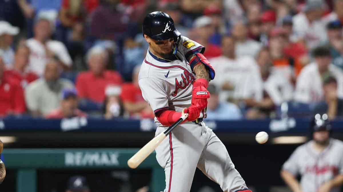 Aug 30, 2024; Philadelphia, Pennsylvania, USA; Atlanta Braves shortstop Orlando Arcia (11) hits a home run during the sixth inning against the Philadelphia Phillies at Citizens Bank Park.