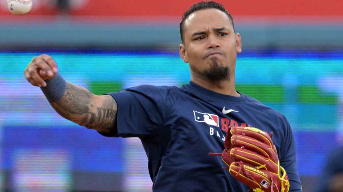 Mar 31, 2025; Los Angeles, California, USA; Atlanta Braves shortstop Orlando Arcia (11) warms up prior to the game against the Los Angeles Dodgers at Dodger Stadium. Mandatory Credit: Jayne Kamin-Oncea-Imagn Images