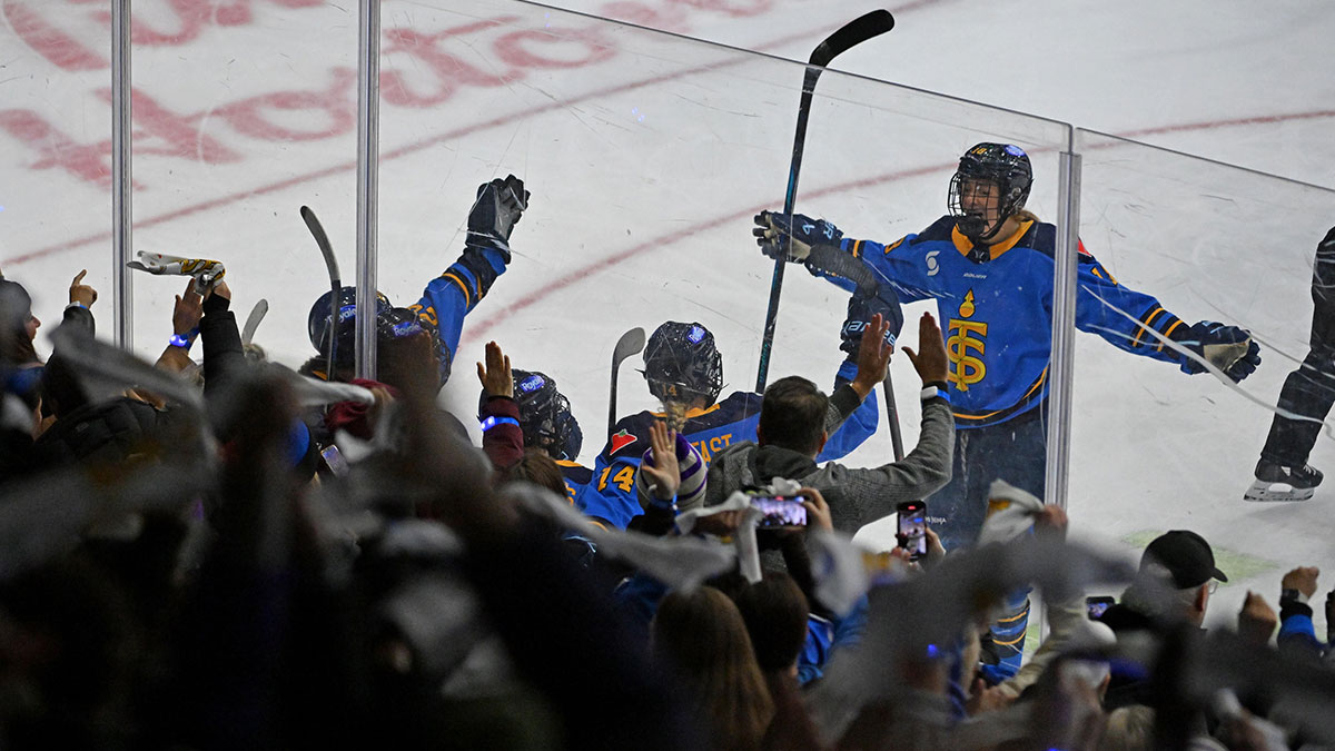 PWHL Toronto Sceptres forward Jesse Compher (18) joins team mates and fans as they celebrate a goal scored by forward Hannah Miller (34) against the Boston Fleet in the third period at Coca-Cola Coliseum.