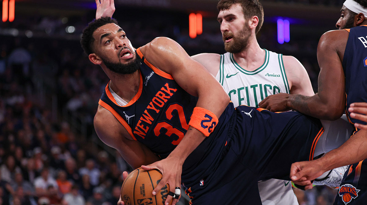 New York Knicks center Karl-Anthony Towns (32) falls out of bounds after a rebound as Boston Celtics center Luke Kornet (40) defends in the first half during game four of the second round for the 2025 NBA Playoffs at Madison Square Garden.