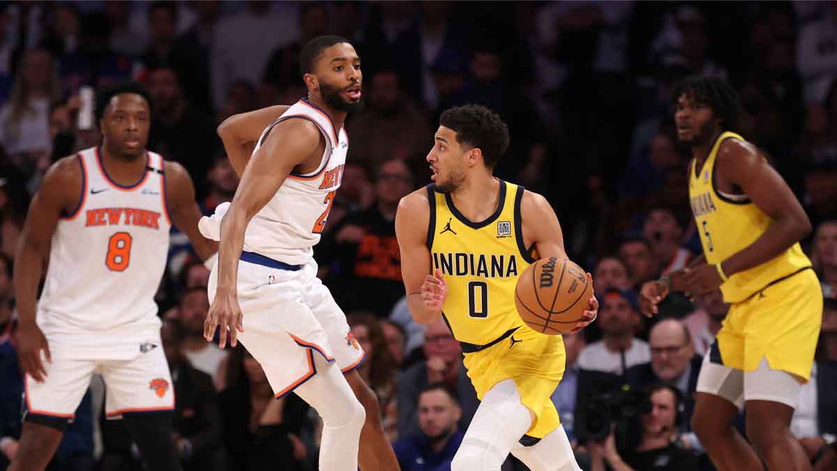 Indiana Pacers guard Tyrese Haliburton (0) controls the ball against New York Knicks forward Mikal Bridges (25) in the fourth quarter during game five of the eastern conference finals for the 2025 NBA Playoffs at Madison Square Garden. 