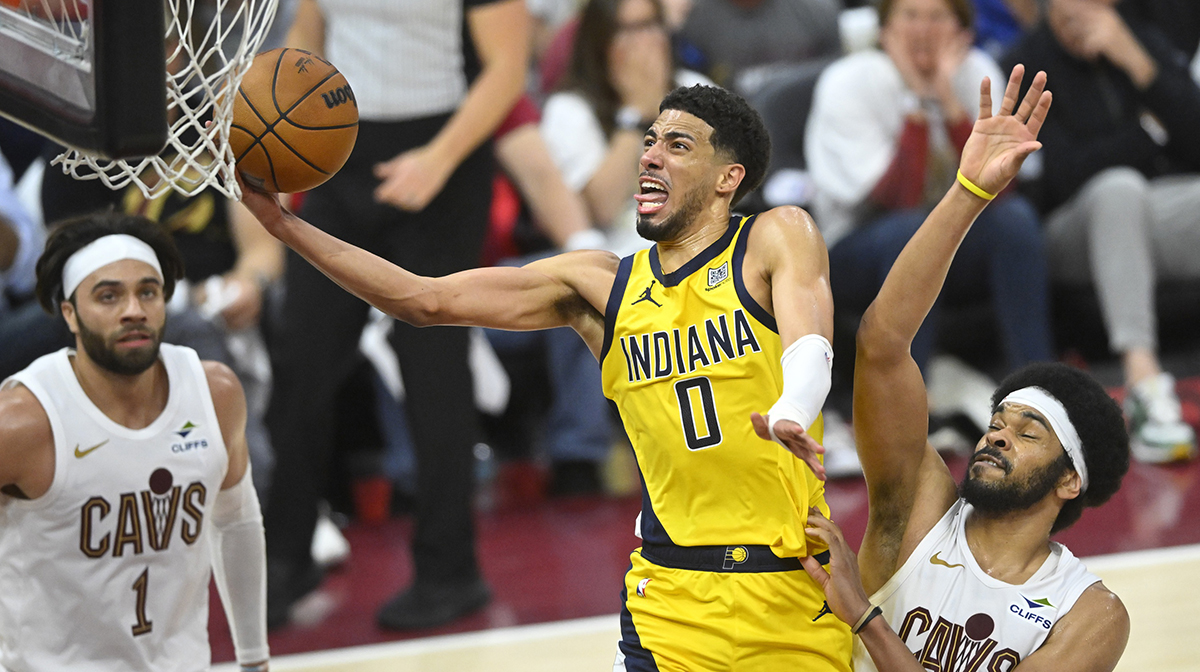 Indiana Pacers guard Tyrese Haliburton (0) drives to the basket between guard Max Strus (1) and center Jarrett Allen (31) in the fourth quarter during game two of the second round of the 2025 NBA Playoffs at Rocket Arena.