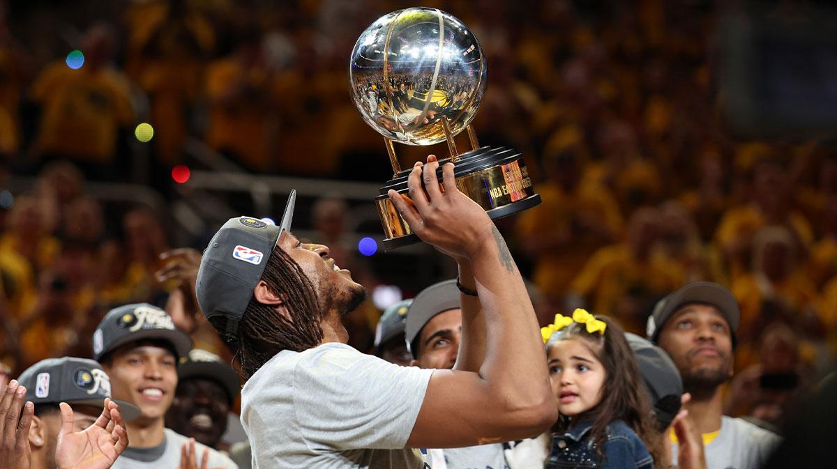Pacers center Myles Turner (33) raises the trophy after game six of the eastern conference finals against the New York Knicks for the 2025 NBA Playoffs at Gainbridge Fieldhouse