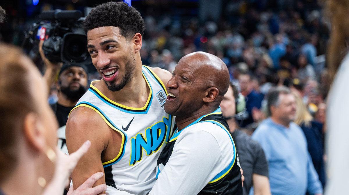 Pacers guard Tyrese Haliburton (0) and his dad celebrate the win