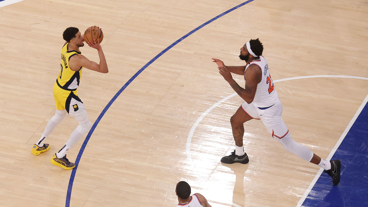 Indiana Pacers guard Tyrese Haliburton (0) shoots a game-tying two point shot to send the game to overtime in the fourth quarter against New York Knicks center Mitchell Robinson (23) during game one of the eastern conference finals for the 2025 NBA Playoffs at Madison Square Garden.