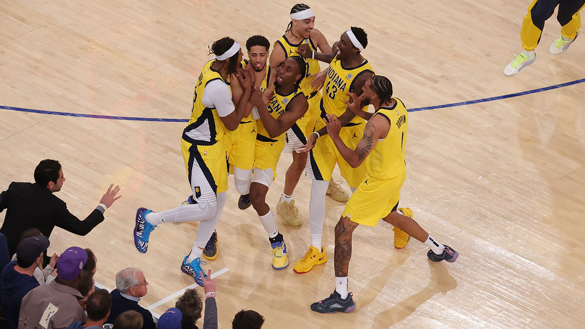 Pacers guard Tyrese Haliburton (0) celebrates with teammates after tying the game in the fourth quarter to send the game to overtime against the New York Knicks during game one of the eastern conference finals for the 2025 NBA Playoffs at Madison Square Garden