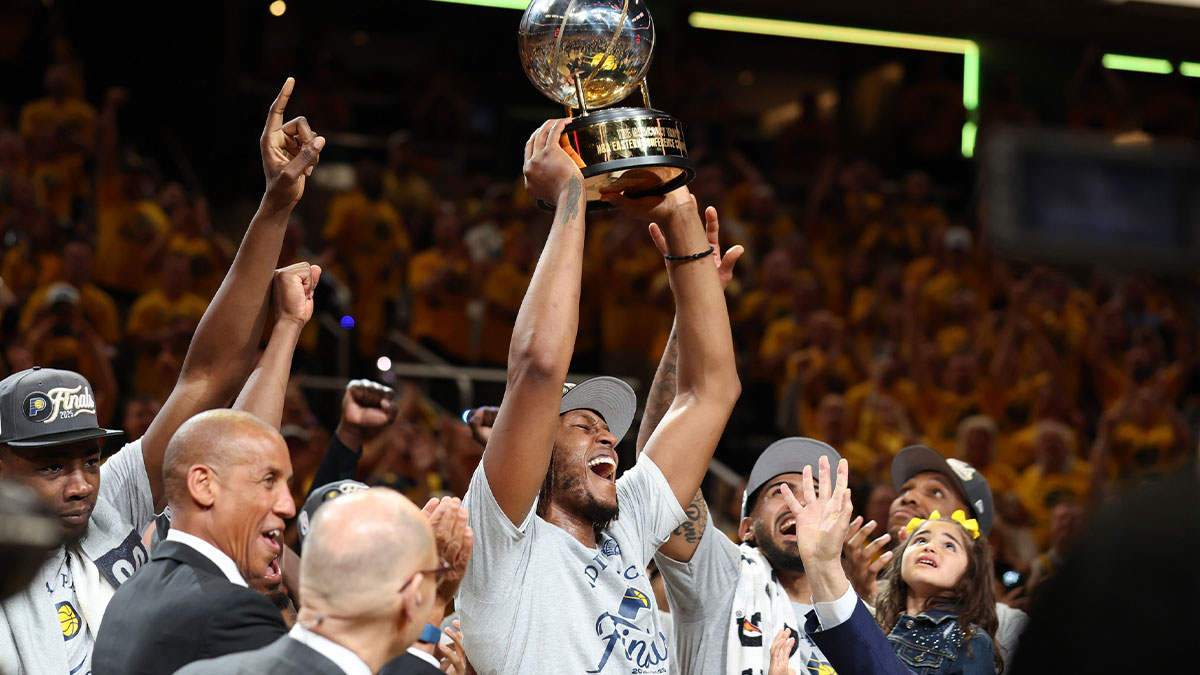 Indiana Pacers center Myles Turner (33) raises the trophy after game six of the eastern conference finals against the New York Knicks for the 2025 NBA Playoffs at Gainbridge Fieldhouse.